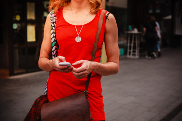 Young woman standing in the street