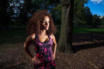 Young Brunette Hispanic woman working out in Central Park