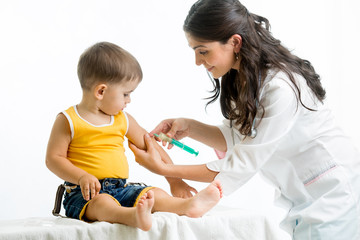 doctor injecting child