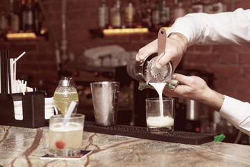 Bartender is making a cocktail