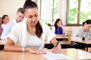 Student woman writing