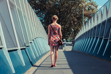 Young woman walking in the street