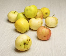 The harvest of apple on the wooden floor