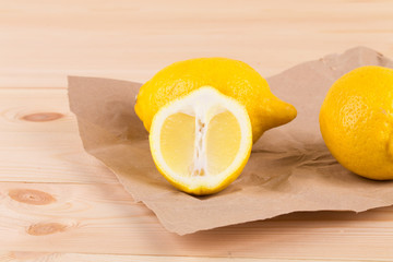 Ripe lemons on paper.
