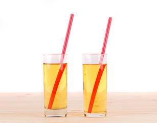 Apple juice on wooden table.