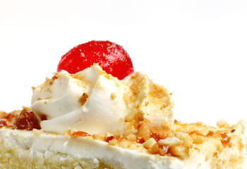 Topping of cream and cherry on Butterscotch Pastry