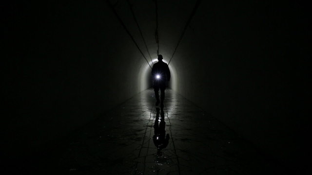 Man Silhouette in a underground bunker from cold war