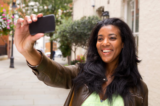 african american woman taking a selfie