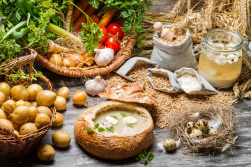 Sour soup with quail egg and fresh vegetables
