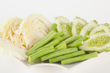 Vegetable side dishes on white paper background