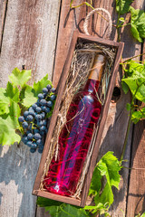 Rose wine in a wooden box