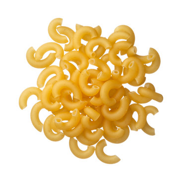 Italian raw pasta cornetti on a pile isolated on white