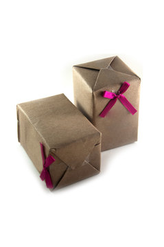 shot of small gift box with pink ribbon