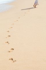 Foot prints on a sandy beach