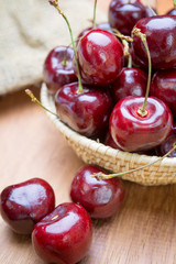 Fototapeta na wymiar Fresh red Cherries on wooden table