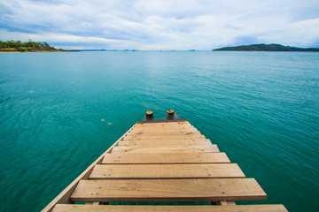 Fototapeta premium Wooden bridge into the sea