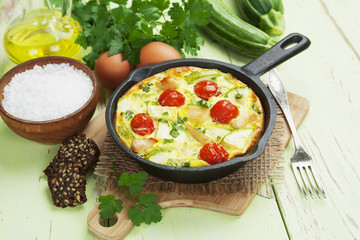 Zucchini baked with chicken, cherry tomatoes and herbs
