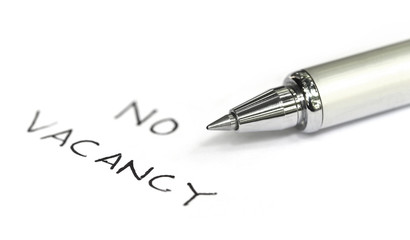 Fototapeta premium No vacancy written on a white paper