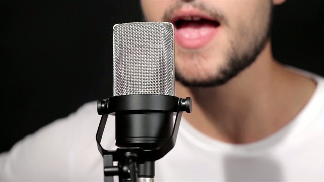 Men singing at microphone
