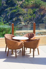 table and four chairs in terrace cafe