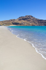 coast line of beach with blue transparent water on Crete island