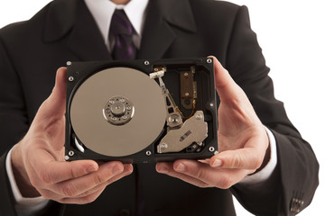 Businessman showing hard drive