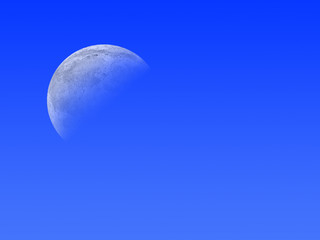 The moon in the blue sky