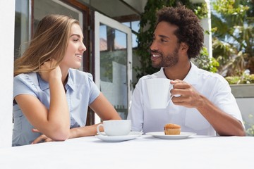 Happy couple having coffee together