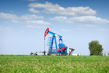 oil pump jack on field
