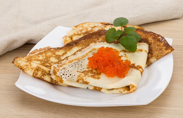 Pancakes with red caviar