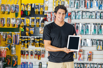 Man Showing Digital Tablet In Hardware Store