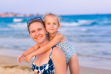 Mother with her daughter at the seashore