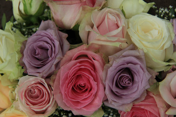 Pastel roses in bridal arrangement