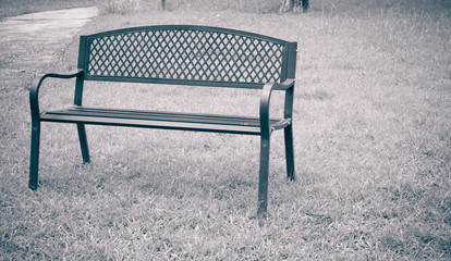 wooden park bench at the public park image