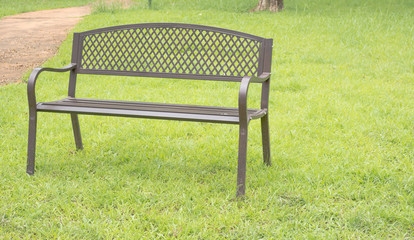Fototapeta premium wooden park bench at the public park image