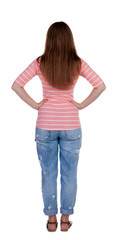 back view of standing young beautiful  redhead woman.