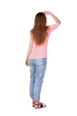 back view of standing young beautiful  redhead woman.