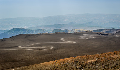 Serpentine road to the top of Mount Etna volcano