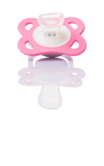 A pink pacifier over white background