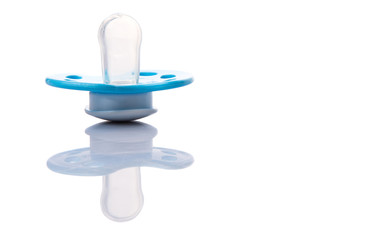 Blue pacifier over white background 