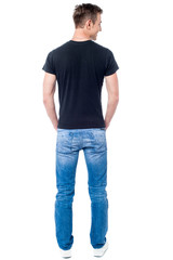 Obraz premium Rear view of young casual man