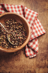 Pepper in a bowl on the table and kitchen towel