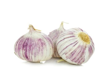 A group of pink garlic bulbs on a white background
