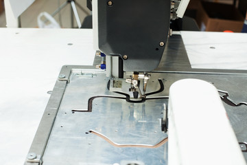 Close-up of sewing machine stitching on patterns