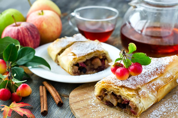 Baked strudel with apples on a plate