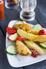 baked potato and raw vegetables on a white plate