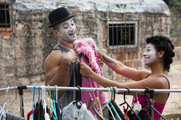 Obraz na płótnie Canvas Cirque Clowns Fitting Costumes
