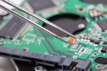 worker repair green harddisk pcb