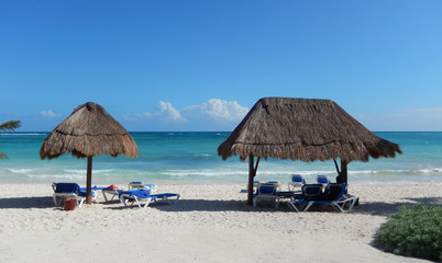 Caribbean beach with straw huts