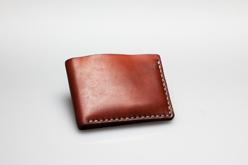 brown leather wallet on white, close up